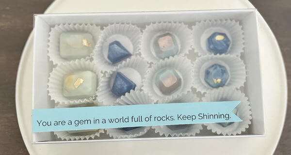 12 blue chocolate gems.
